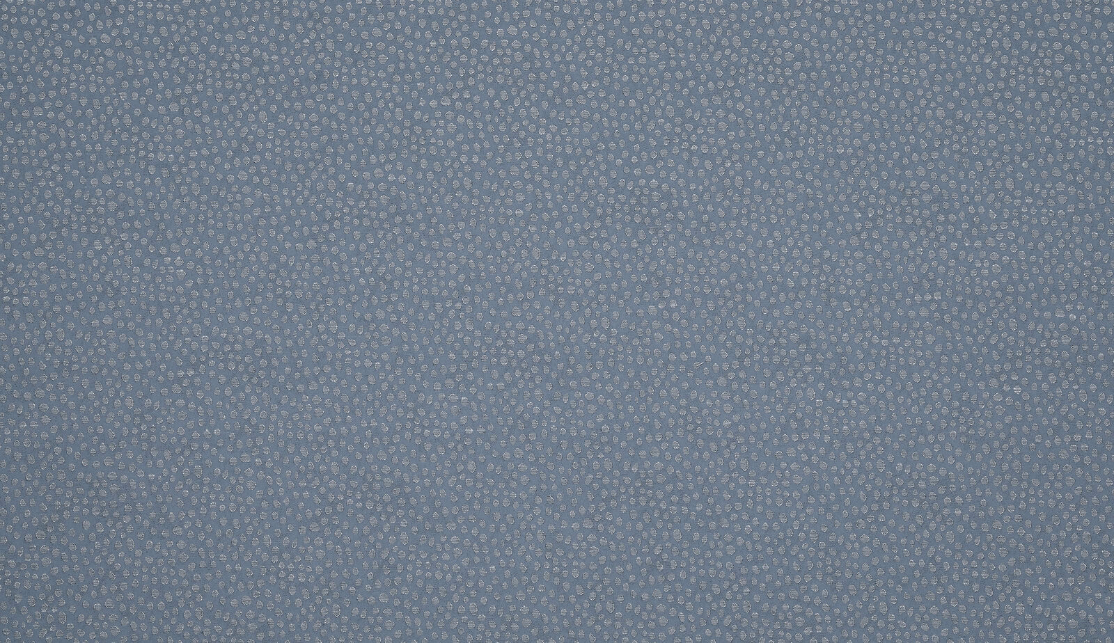 Soft slate blue woven fabric with a fine speckled dot texture