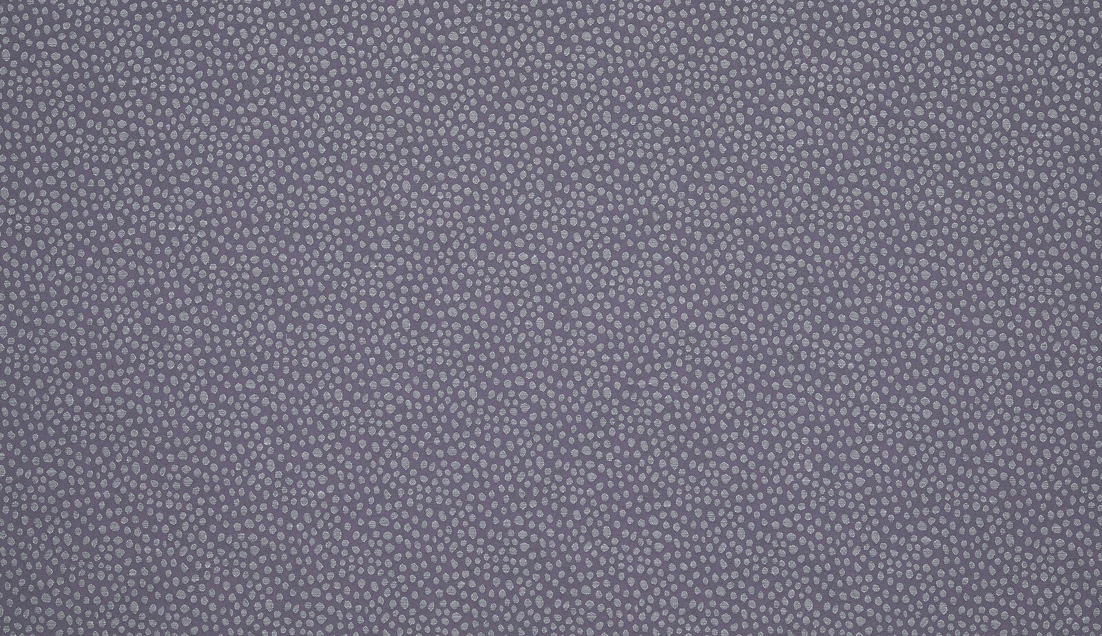 Close-up of a small-scale speckled woven fabric in soft lavender-grey