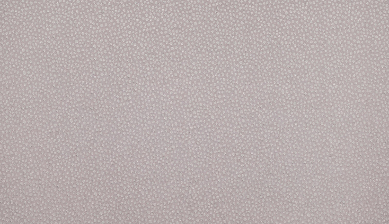 Soft mauve textured fabric with tiny dotted weave close-up
