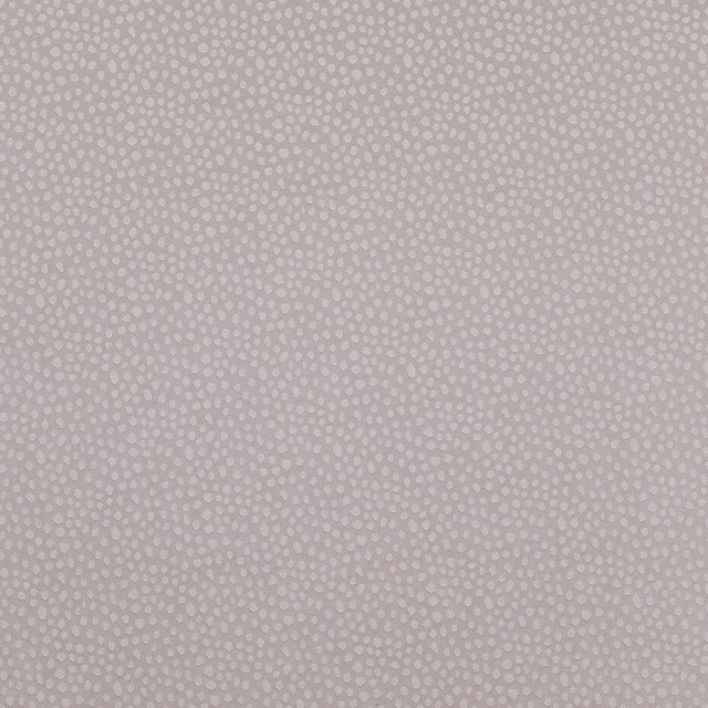 Soft mauve textured fabric with tiny dotted weave close-up