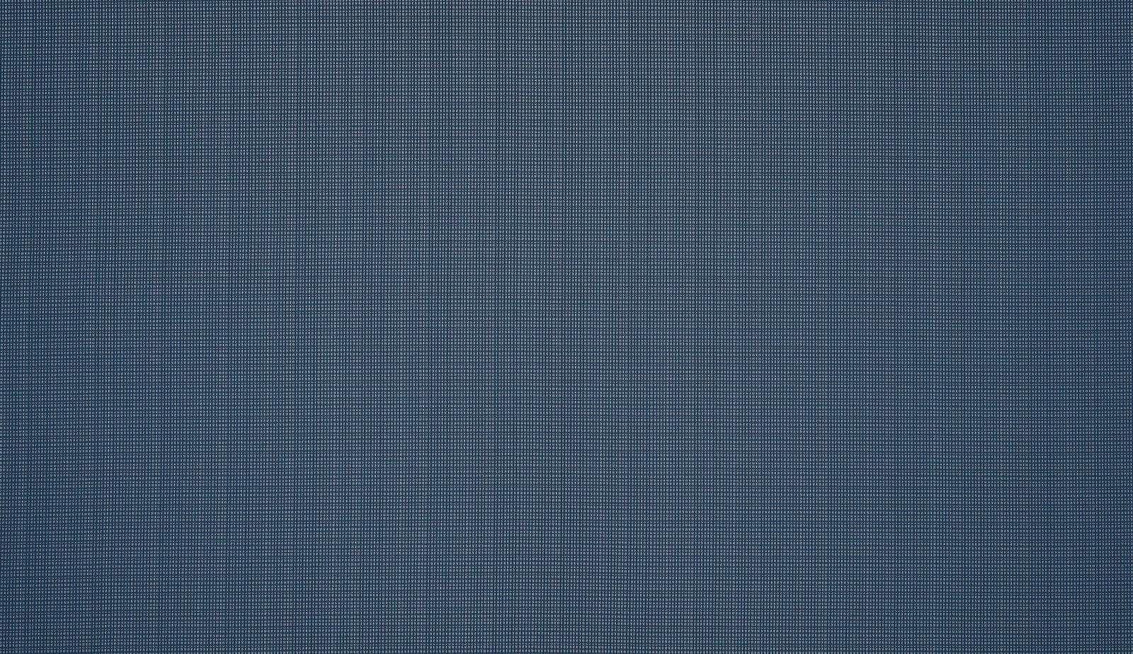 Close-up of muted indigo blue woven fabric with fine grid-like texture