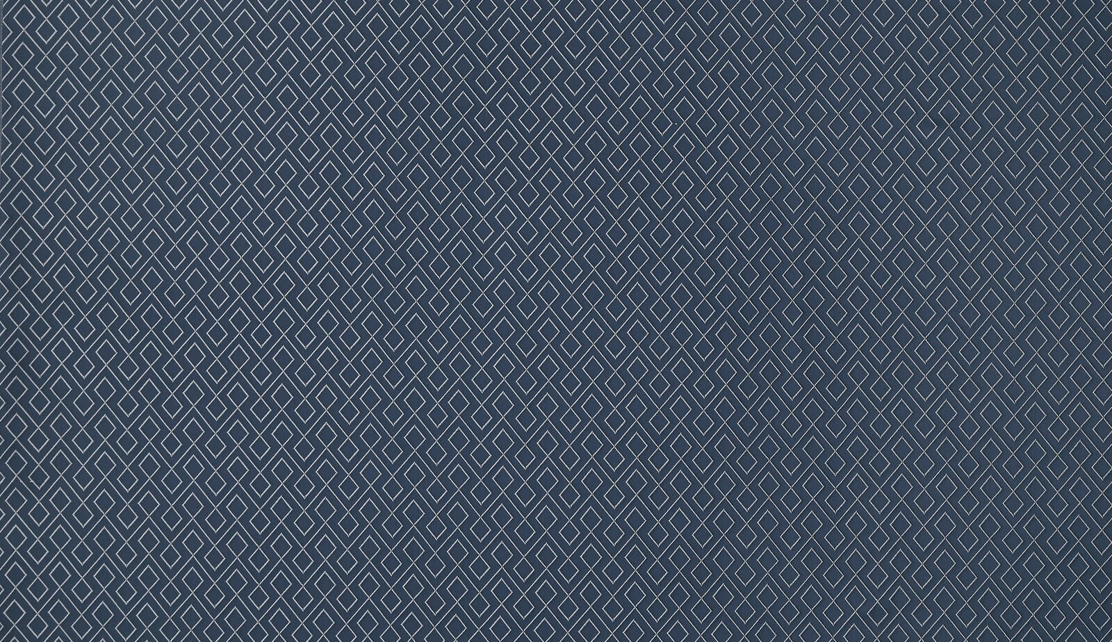 Deep indigo fabric swatch with a small white diamond geometric weave