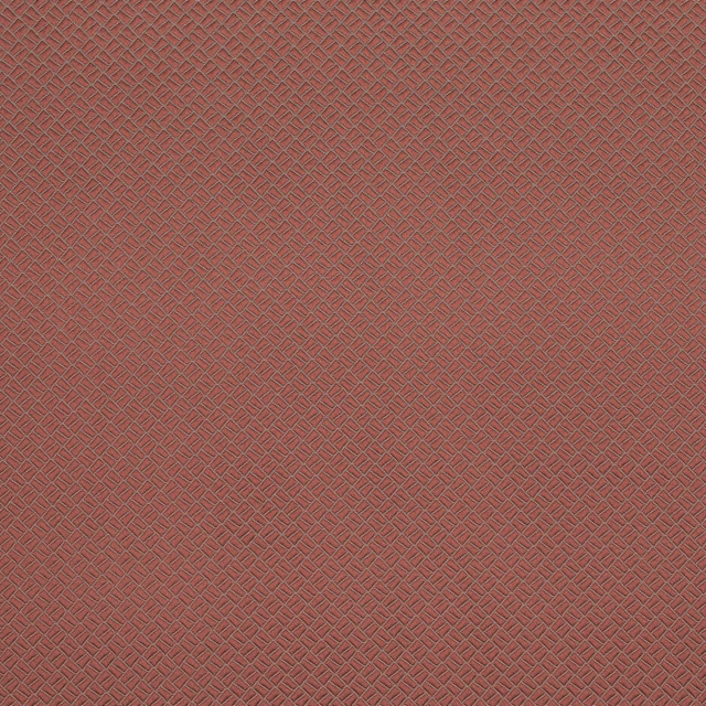 Soft coral terracotta fabric with a small geometric woven texture