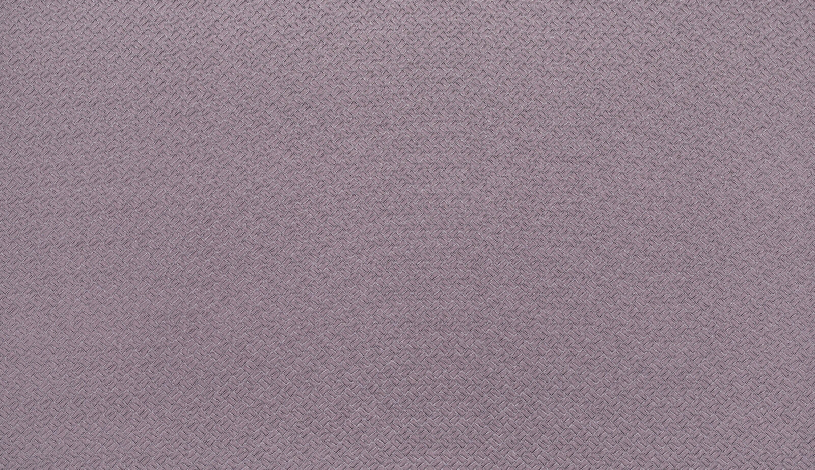 Close-up of soft heathered mauve fabric with small geometric woven texture