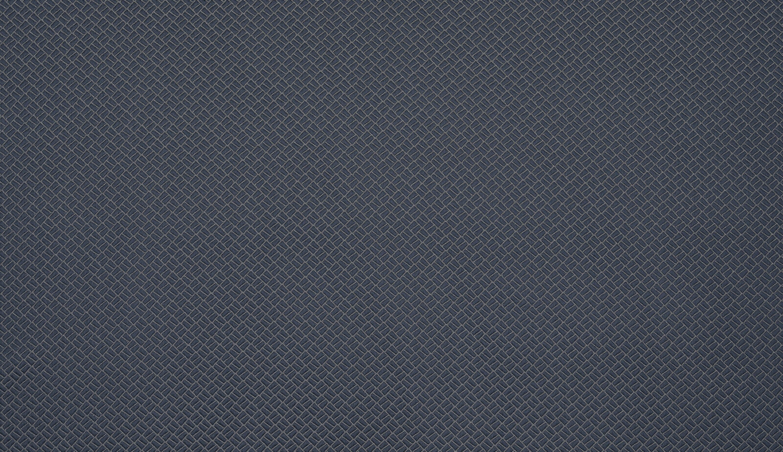 Dark indigo geometric woven fabric swatch with fine diagonal texture