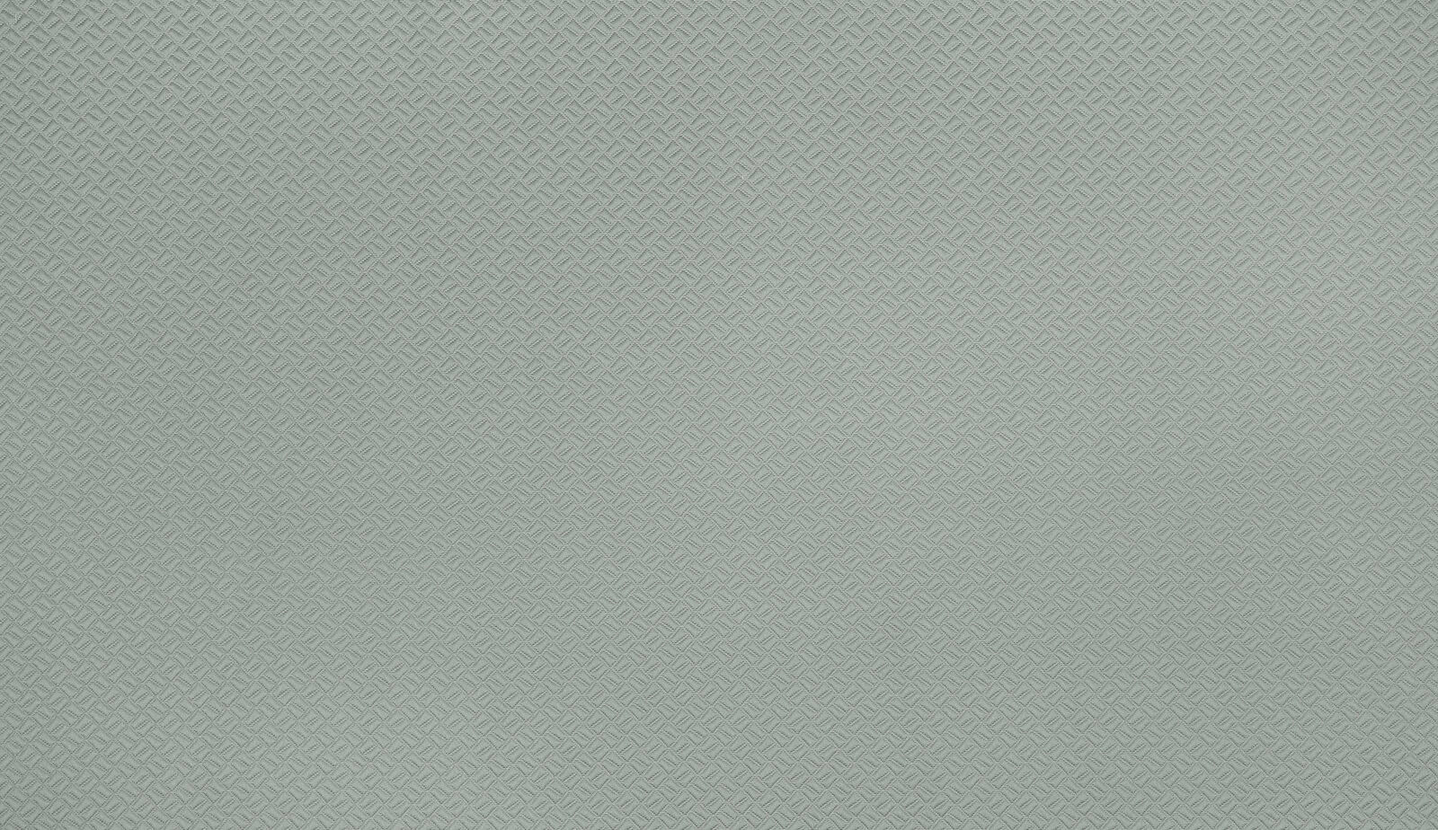 Soft seafoam green woven fabric with tiny geometric pattern texture