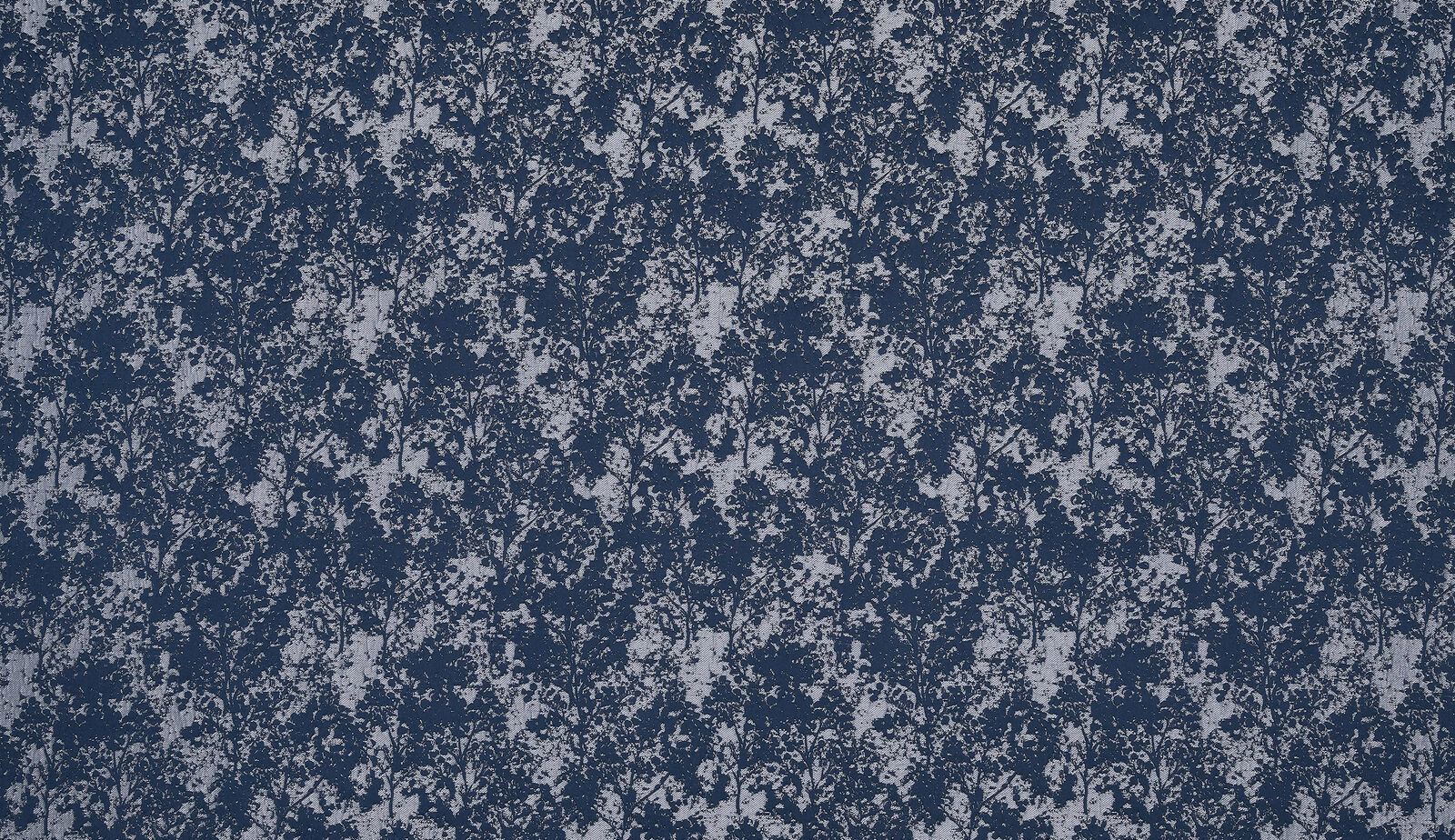 Deep indigo botanical weave with pale blue-grey foliage pattern