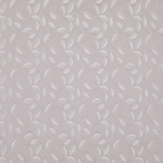 Pale orchid pink woven fabric with small leaf floral motif and soft sheen