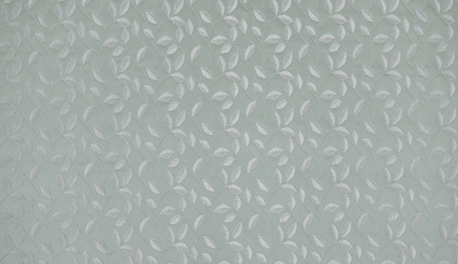 Soft seafoam green fabric with small repeating leaf motif and subtle woven texture