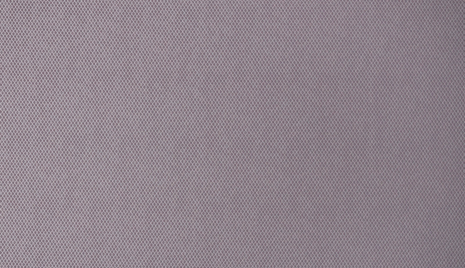 Close-up of soft amethyst lilac woven fabric with small geometric diamond texture