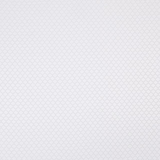 Pale ivory woven fabric with a small repeating geometric texture