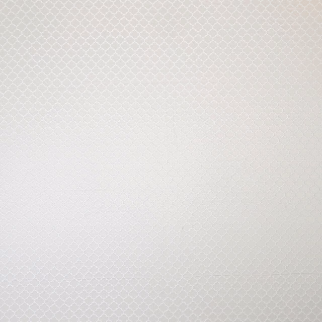 Pale pearl ivory woven fabric with tiny geometric diamond pattern