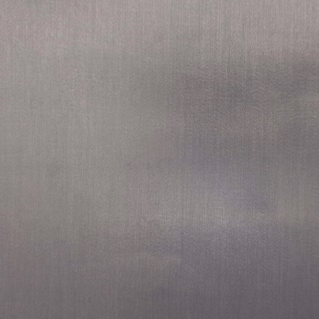 Soft aluminium-grey plain fabric with a smooth, lightly reflective weave