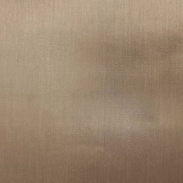 Warm caramel plain woven fabric swatch with a smooth matte-sheen finish