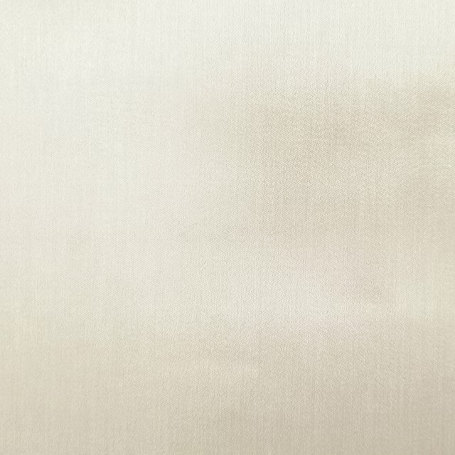 Soft ivory cream plain woven fabric with a smooth, subtle texture