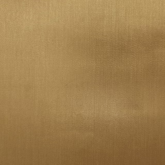 Warm gold plain woven fabric with a soft satin sheen