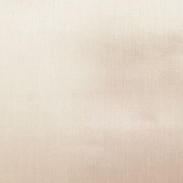 Pale oyster cream plain fabric with a smooth, softly woven texture