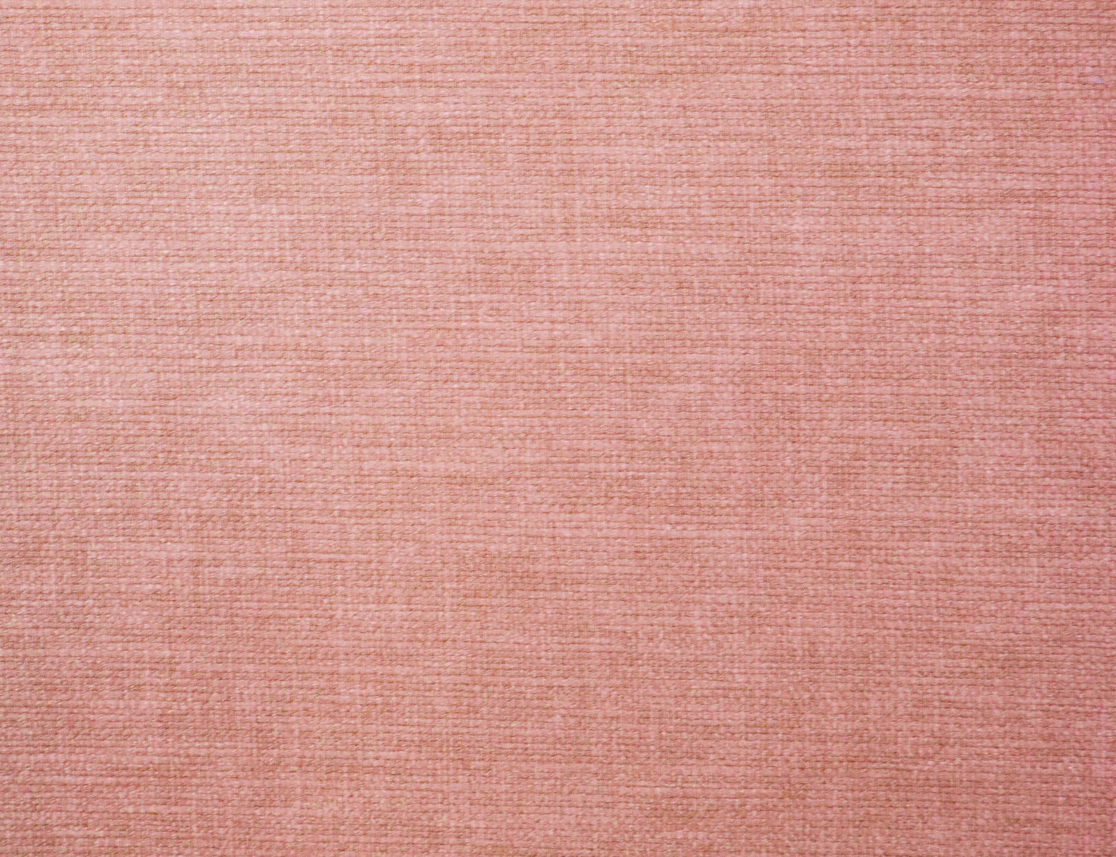 Soft coral pink plain woven fabric swatch with fine horizontal texture