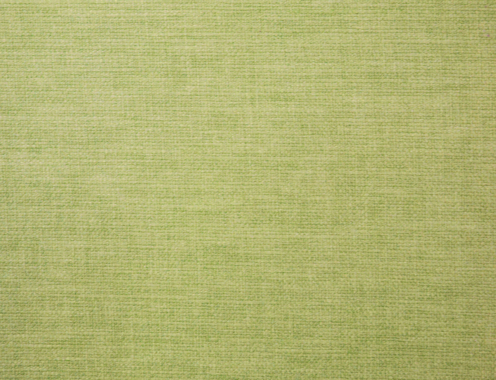 Soft grassy green plain woven fabric with subtle textured slub