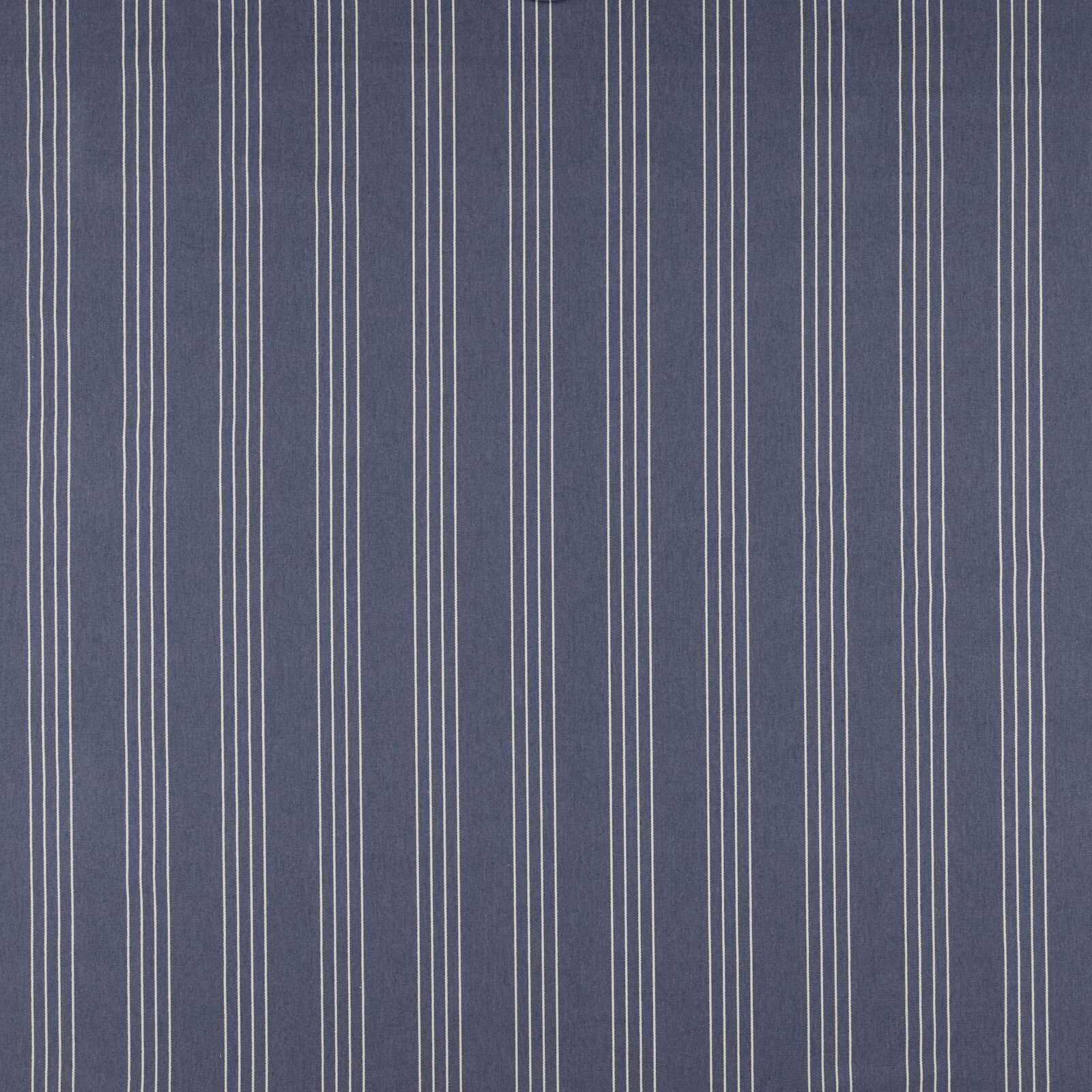 Blue striped fabric with fine pale vertical pinstripes on a muted indigo ground