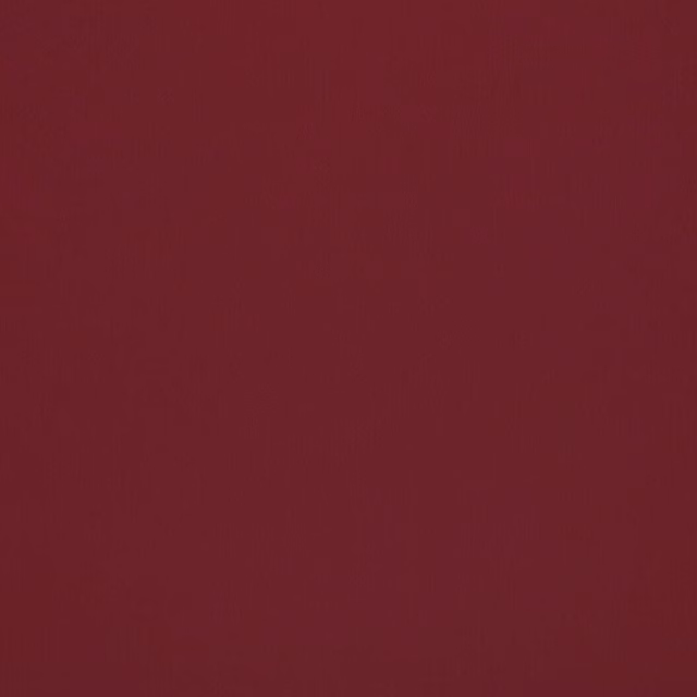 Deep crimson plain fabric swatch with a smooth, low-texture finish