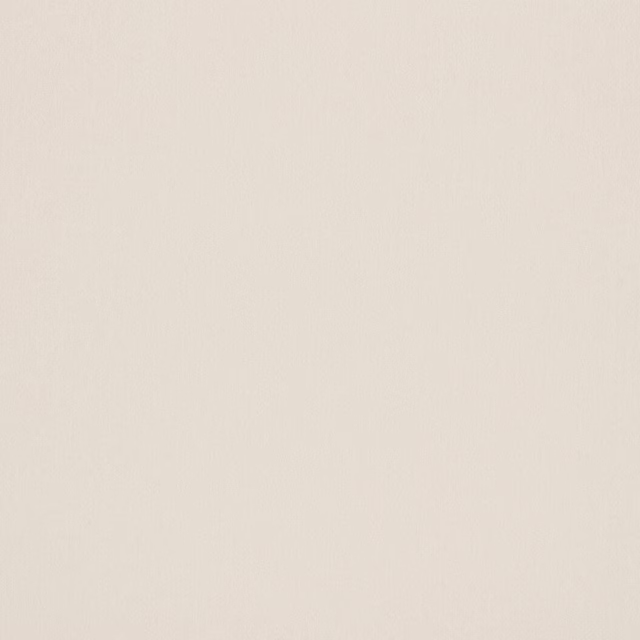 Close-up of a smooth ivory plain fabric swatch with a soft creamy tone