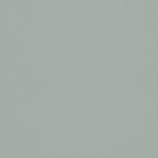 Soft pistachio green plain fabric swatch with a smooth, even finish
