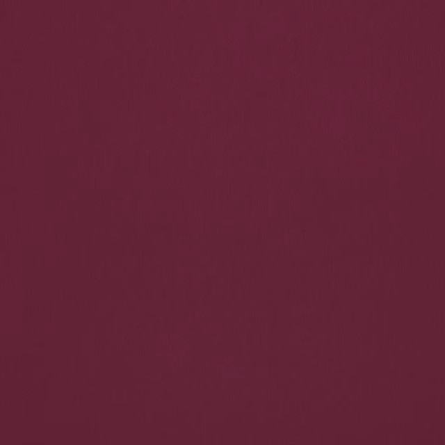 Solid deep wine-plum plain fabric swatch with a smooth matte finish