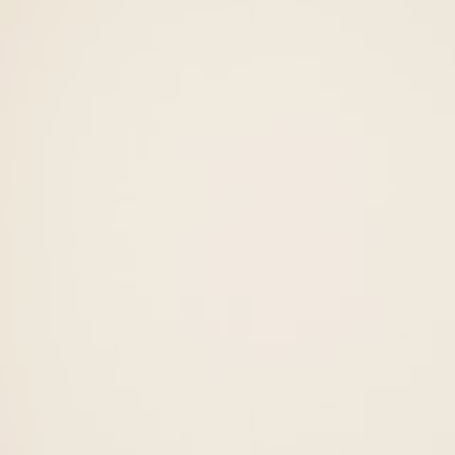 Soft ivory plain weave fabric with a smooth, matte finish