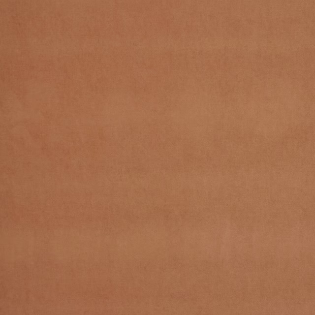 Plain warm papaya-orange upholstery fabric with a soft matte finish