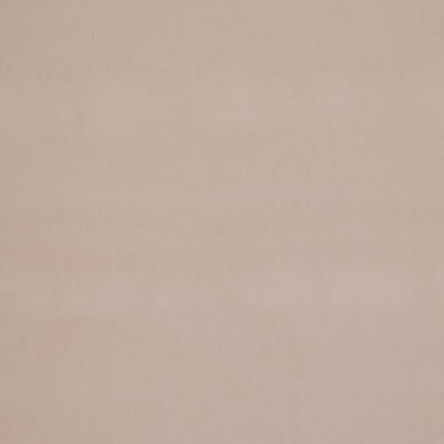 Plain shell-beige upholstery fabric with a smooth, matte woven surface