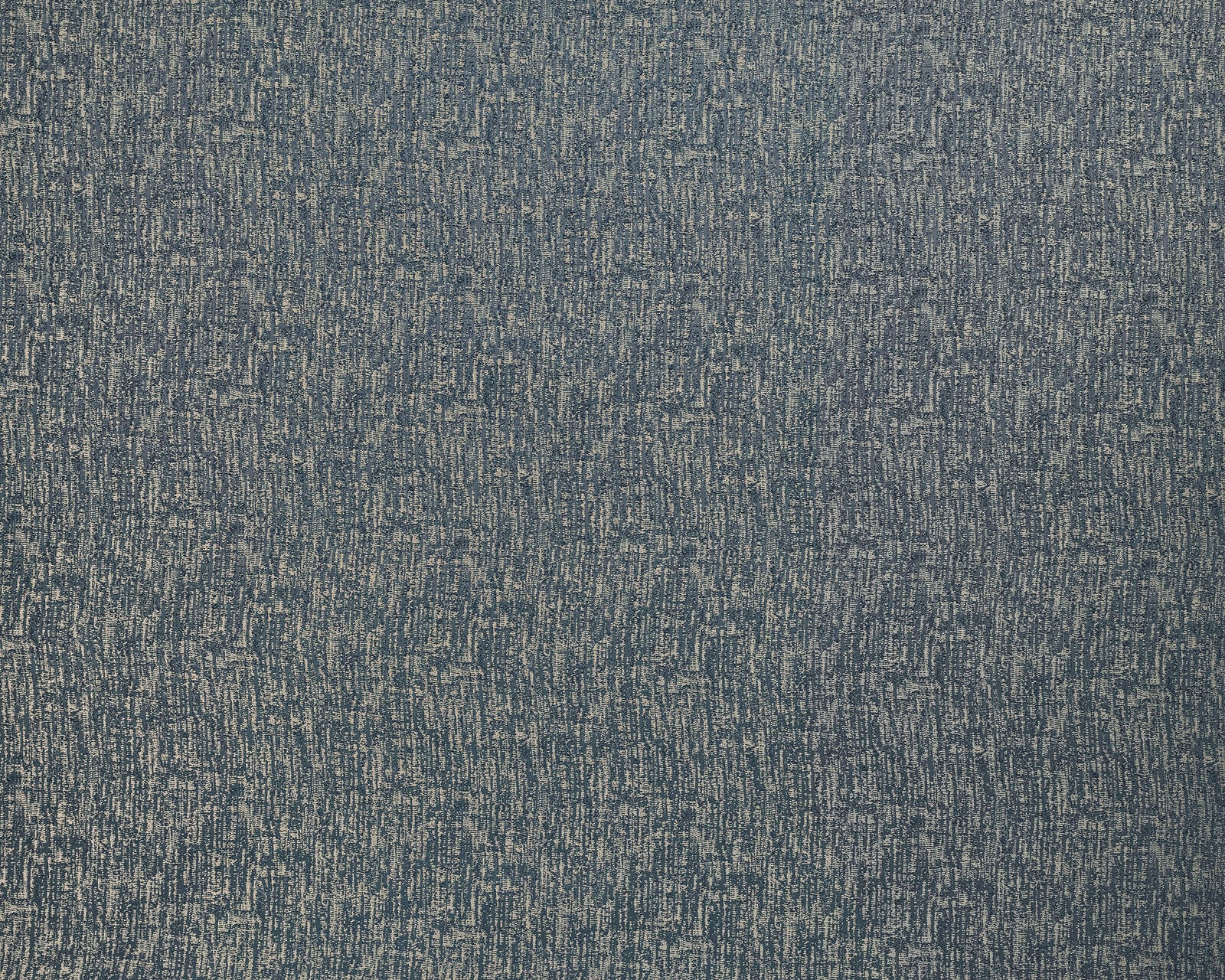 Close-up of muted blue-grey textured fabric with fine slubbed weave