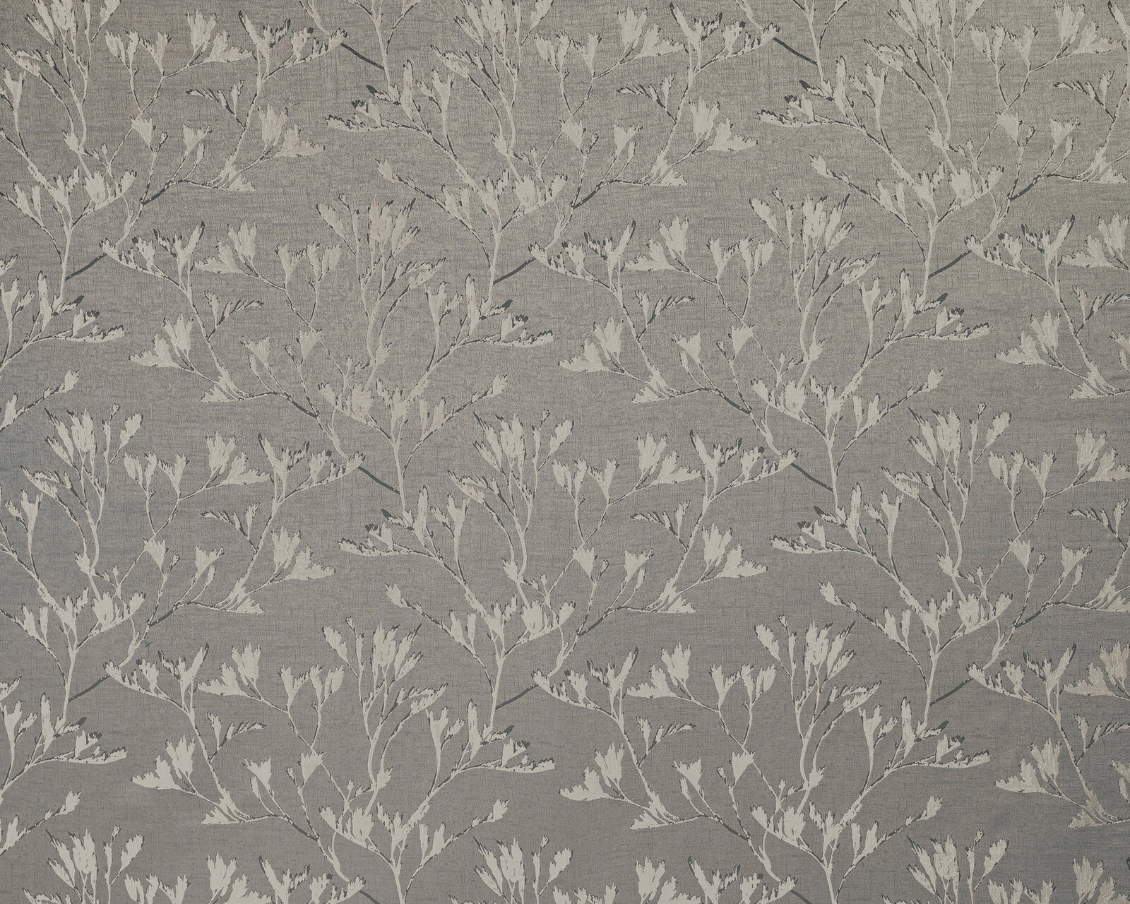 Soft pebble grey botanical fabric with pale trailing leaf motif