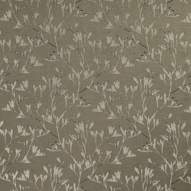 Muted olive botanical fabric with pale leaf branches and textured woven ground