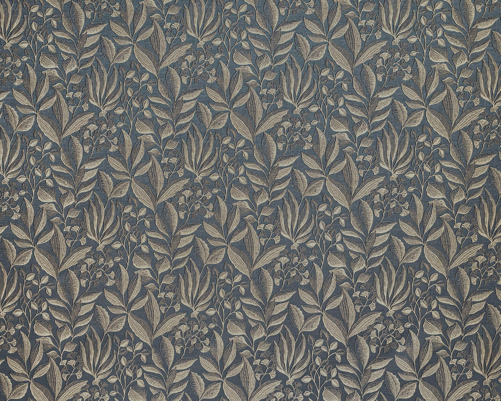 Botanical fabric with muted blue ground and pale leaf-and-flower print