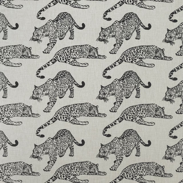 Ivory fabric swatch with ebony leopard print in a large repeating pattern