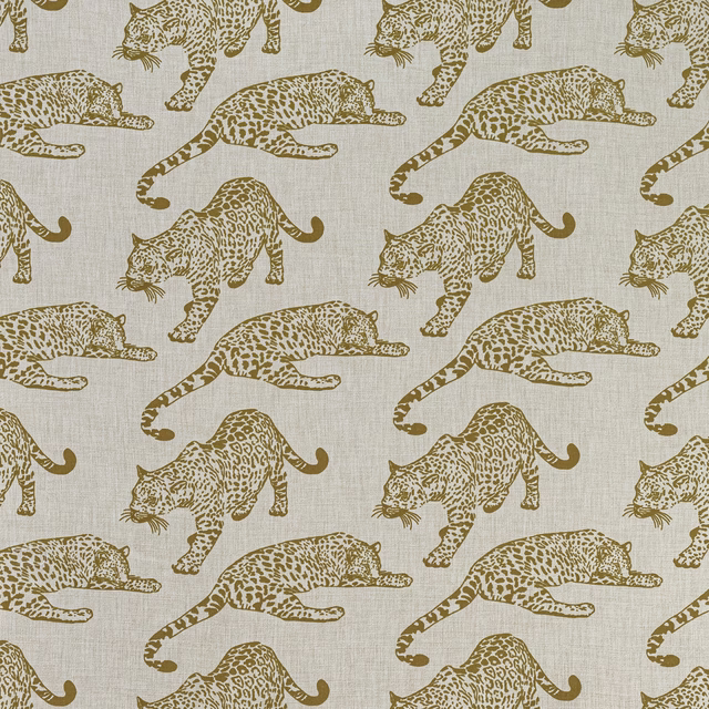 Sand beige fabric with repeating leopard motif in golden brown print