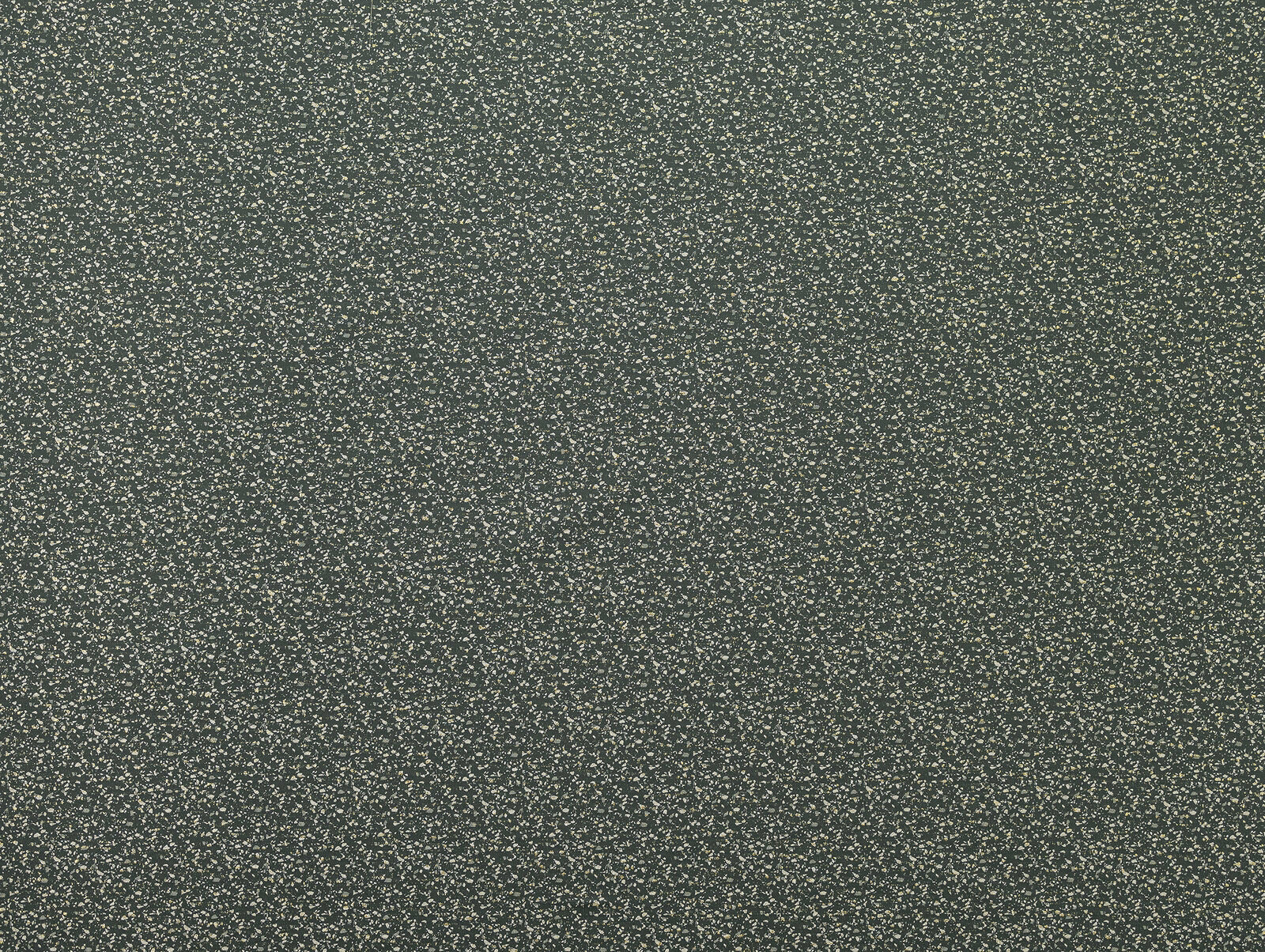 Close-up of dark moss green speckled textured fabric with tiny pale flecks