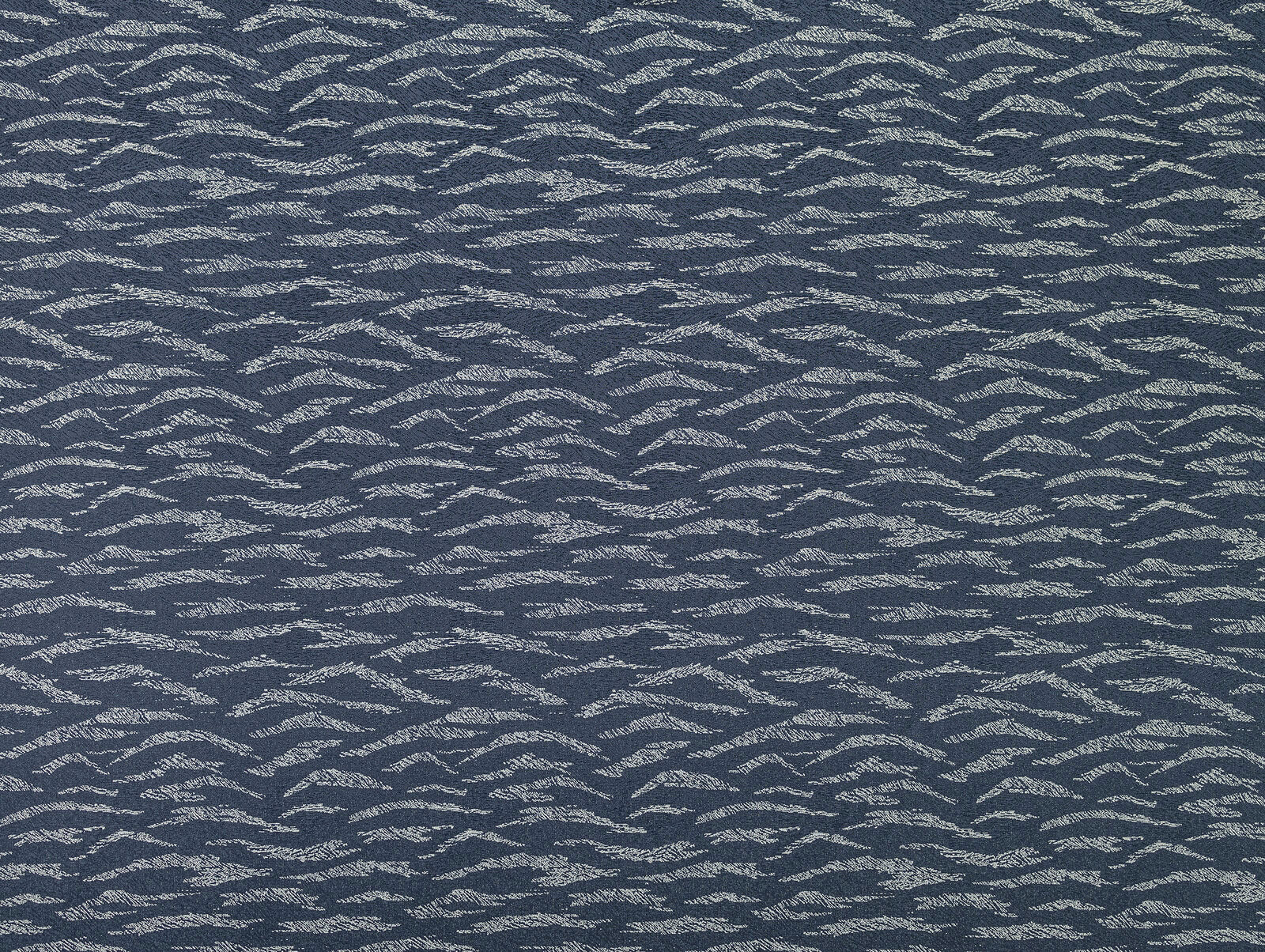 Midnight blue textured woven fabric with silvery wave-like highlights