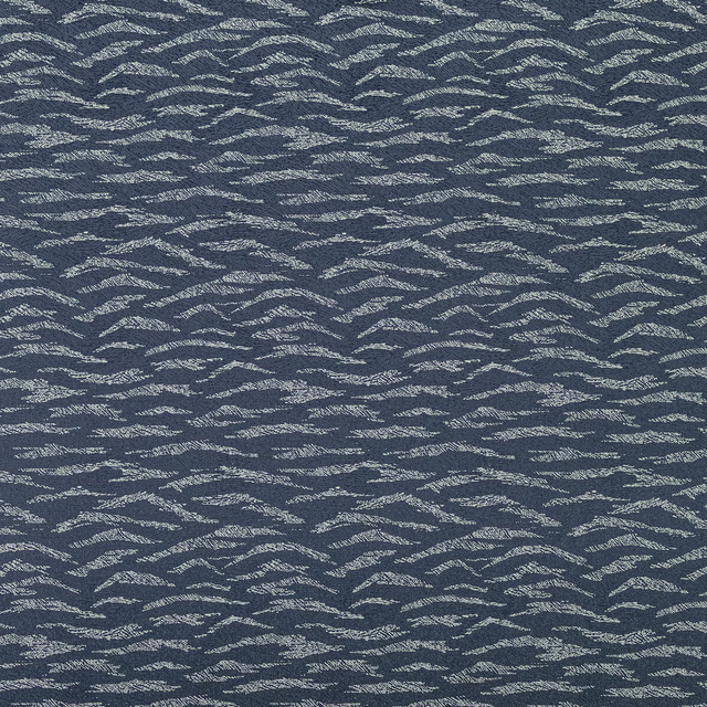Midnight blue textured woven fabric with silvery wave-like highlights