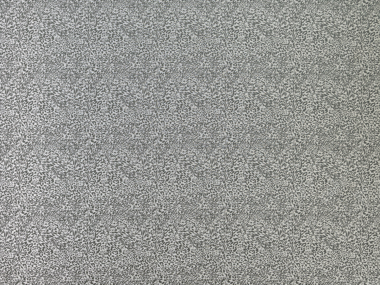 Grey animal-print drapery fabric with a fine all-over spotted texture