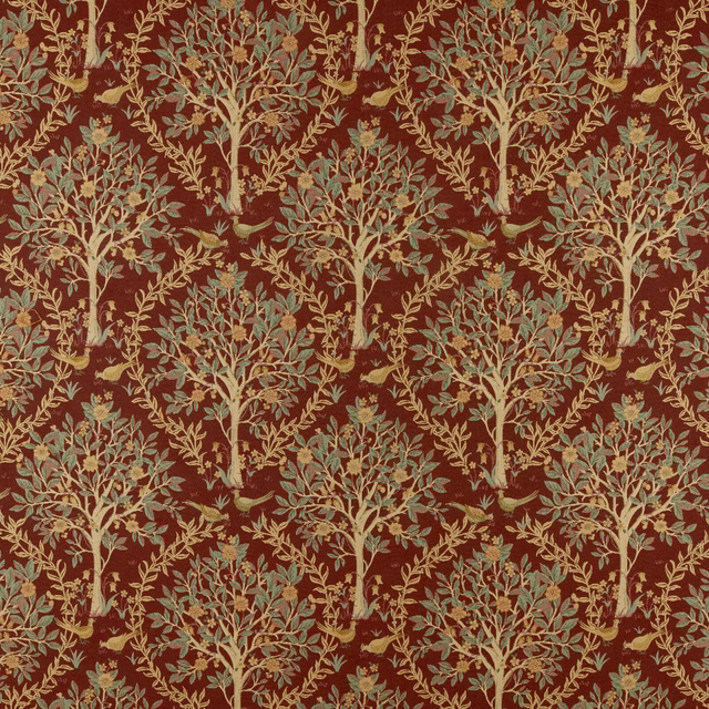 Deep merlot red fabric with repeated pale tree motifs and leafy branches