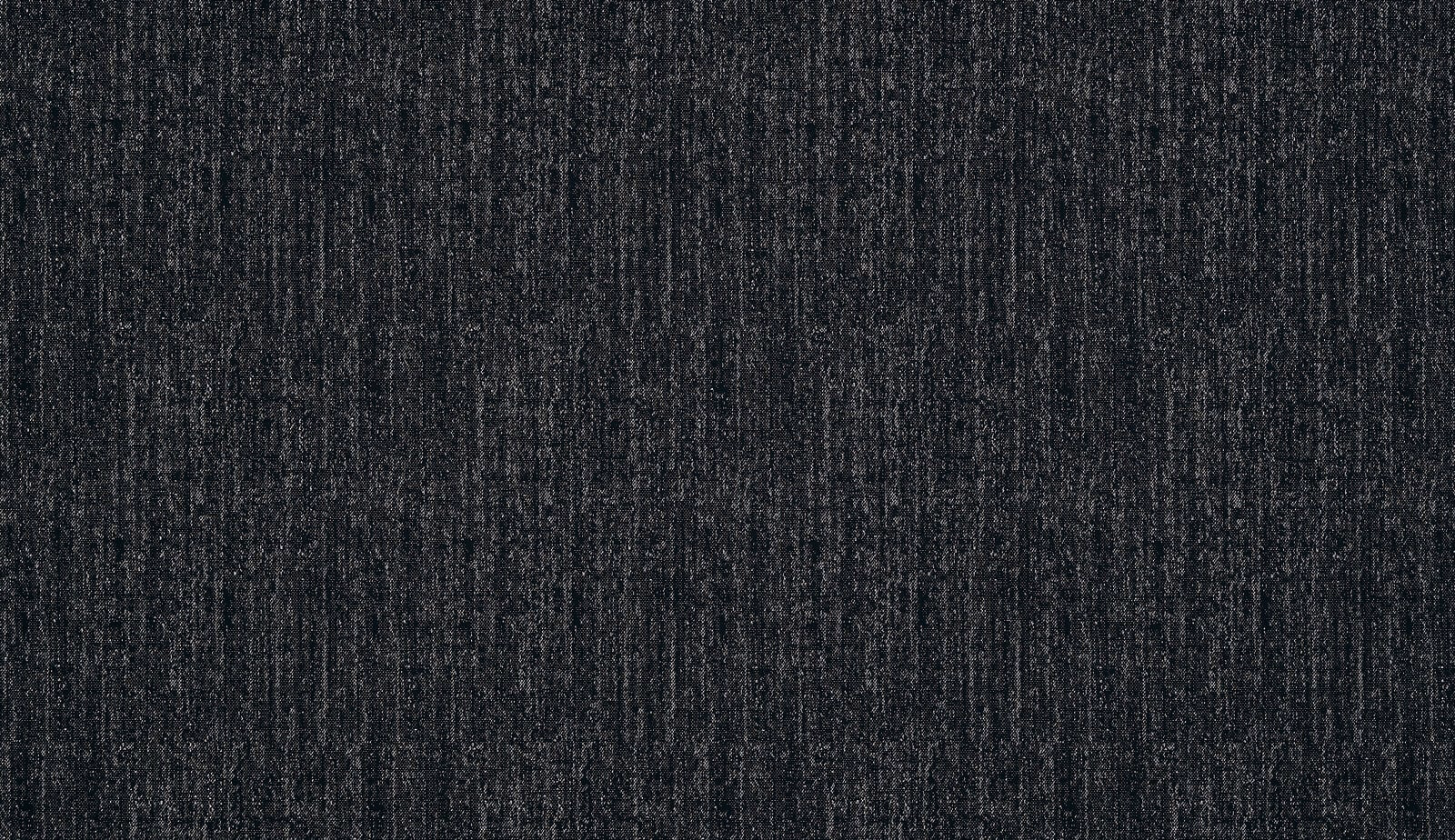 Close-up of charcoal-black textured fabric with fine vertical tonal flecks