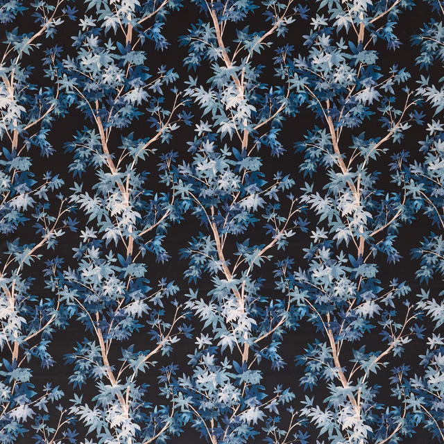 Trailing blue and pale botanical leaves on a dark midnight ground