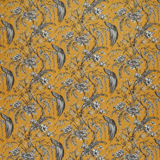 Mustard yellow botanical fabric with birds, flowers and trailing foliage in monochrome print