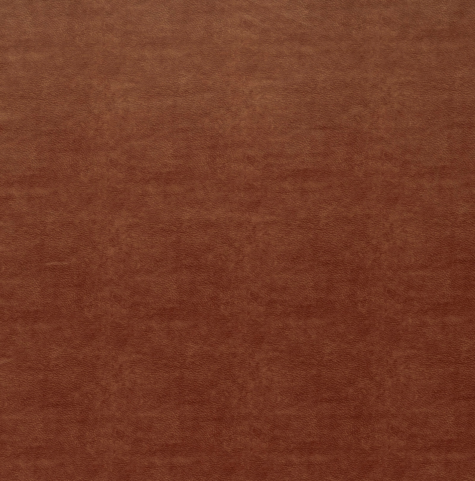 Close-up of a deep scarlet rust plain-texture fabric with a softly mottled weave