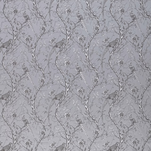 Silver-grey bird and branch patterned fabric with delicate botanical detail