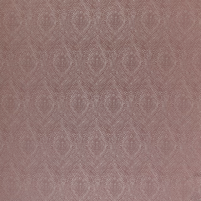 Dusty rose textured fabric with repeating circular geometric medallions