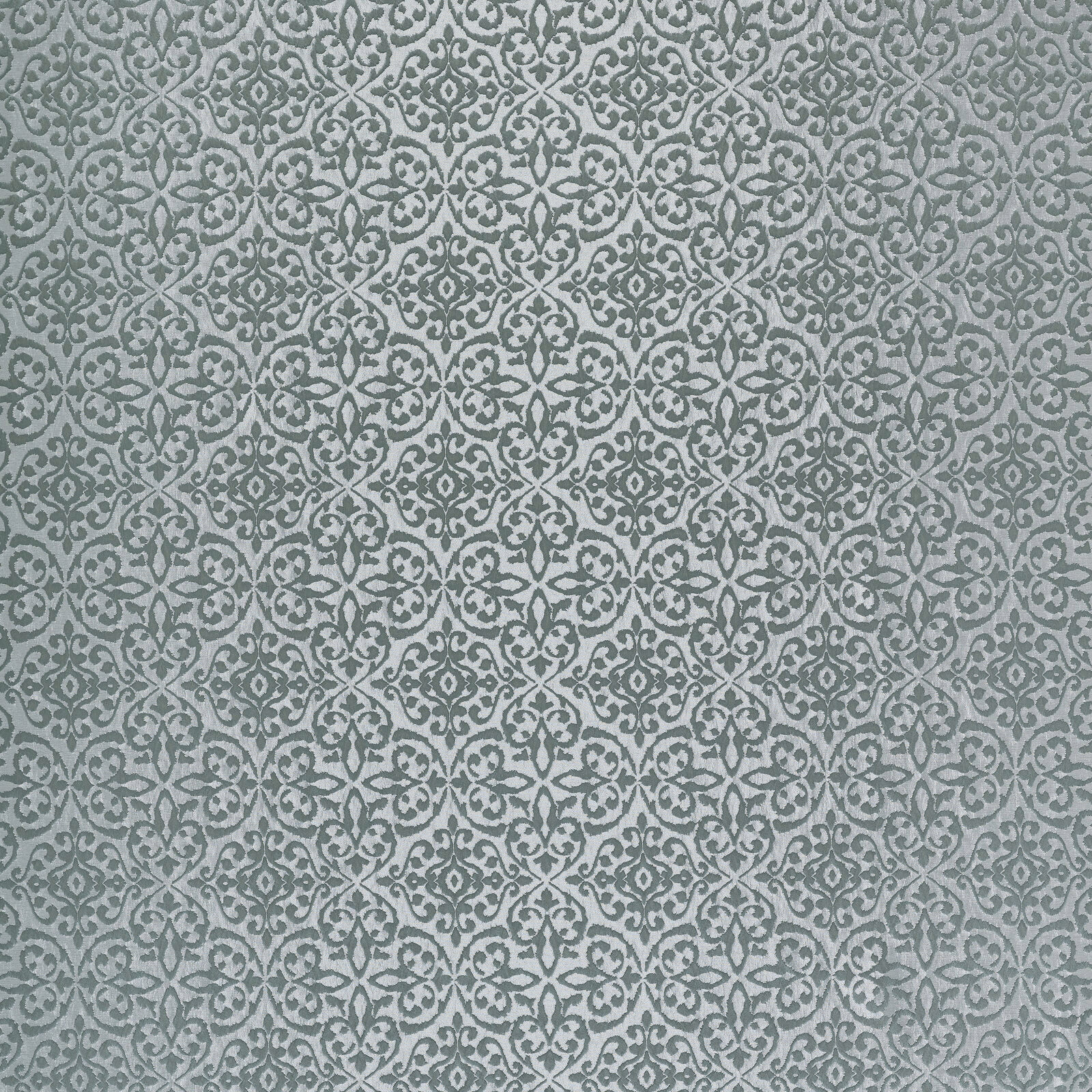 Soft sage green damask fabric with small repeating scroll motifs
