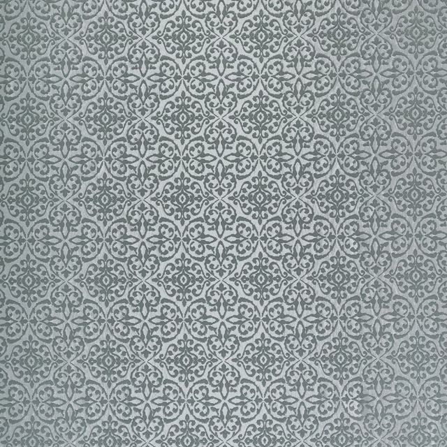 Soft sage green damask fabric with small repeating scroll motifs